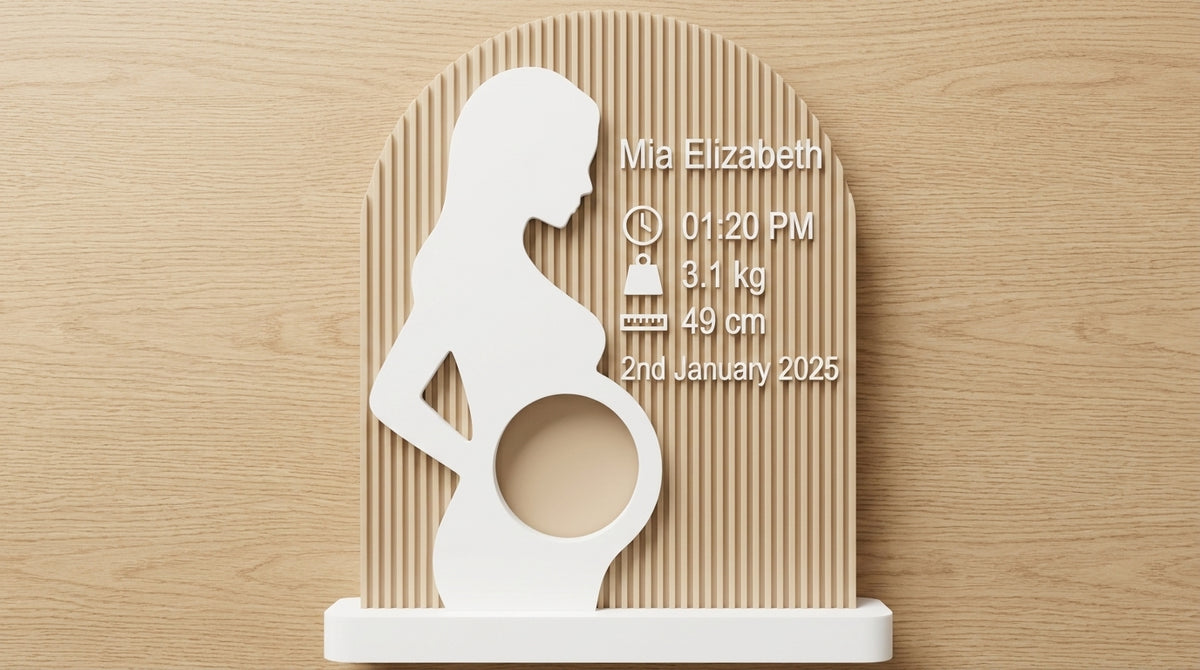Pregnancy silhouette ultrasound frame displayed on a shelf