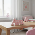 Pink and white personalised desk name sign reading Ava