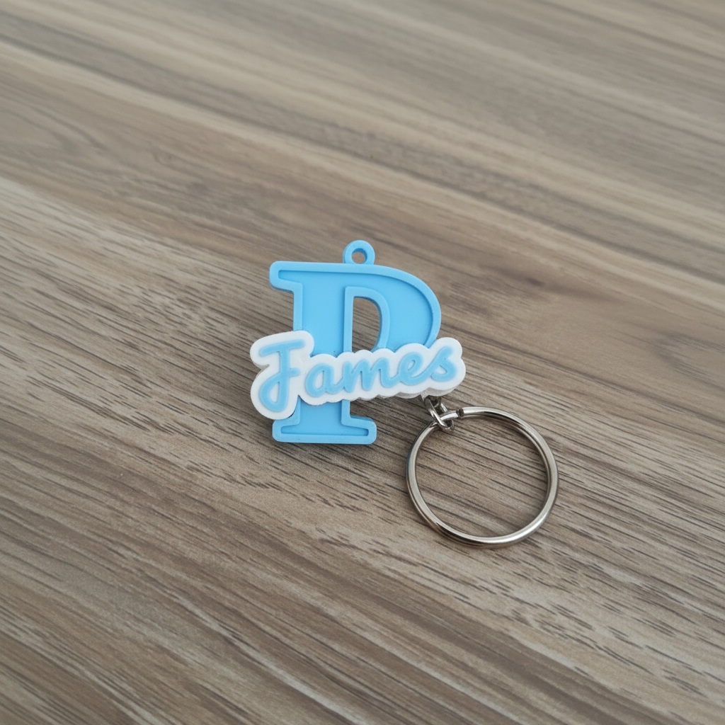 Blue personalised initial and name keyring featuring the letter J and the name James
